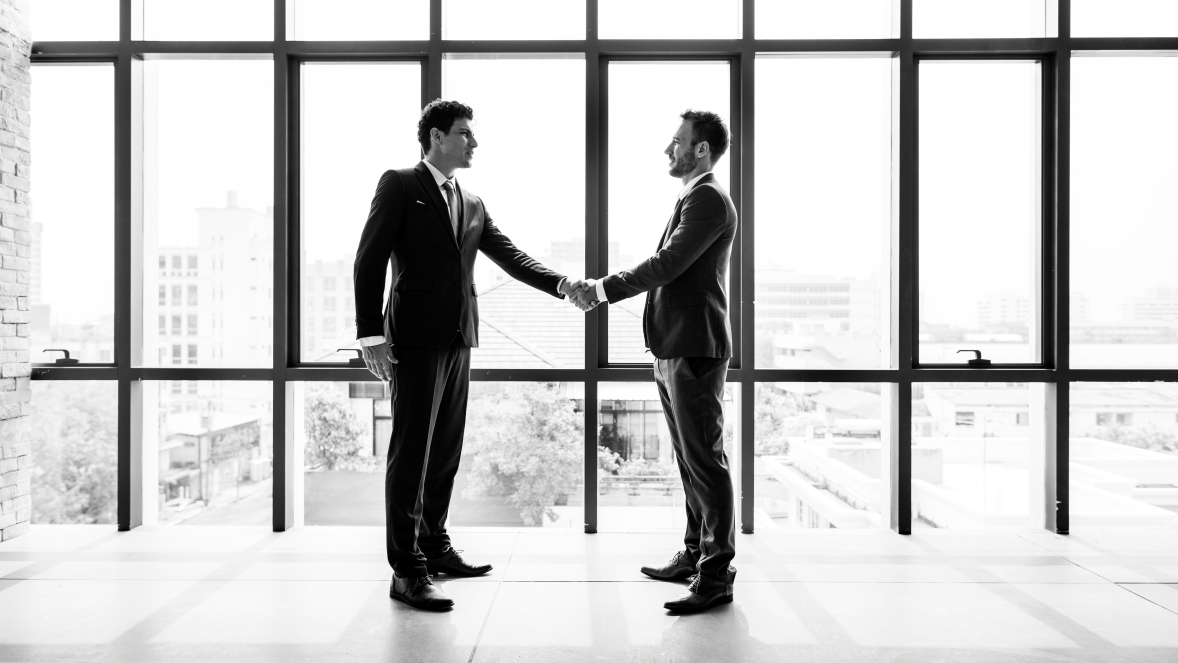 Handshake concluding a company sale